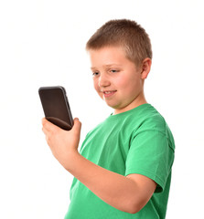 A boy with a mobile phone. A girl in a green T-shirt.