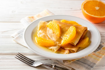 Crepe suzette, traditional french dessert with thin pancakes and orange sauce.
