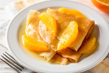 Crepe suzette, traditional french dessert with thin pancakes and orange sauce.