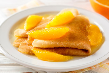 Crepe suzette, traditional french dessert with thin pancakes and orange sauce.