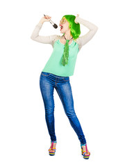 A gorgeous woman with a green wig enjoying singing, holding a microphone on a white background. The girl definitely knows how to perform. Colleagues were surprised by her voice. One day she will becom