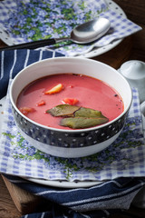 Vegetarian red soup - borsch in green bowl.