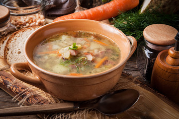 Pea soup with vegetables and bacon.
