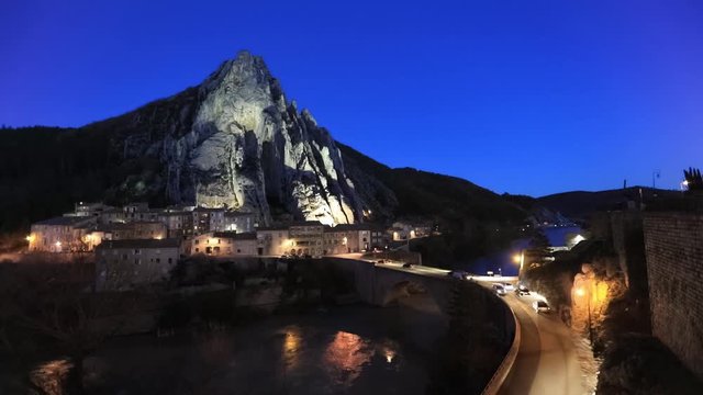Sisteron in the evening: The Rocher de la Baume - peculiar shaped rock and bridge over Durance river, Alpes-de-Haute-Provence, France

