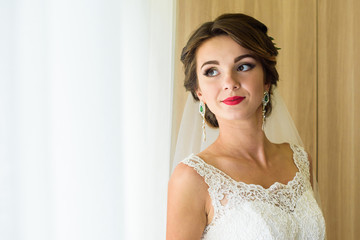 morning of the bride. Wedding preparation. Beautiful young bride preparing for a wedding ceremony