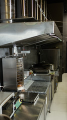 Street food small restaurant kitchen. Professional workspace. Cooking equipment and appliances.