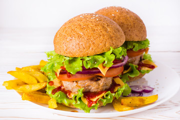 Cheeseburger and french fries on a plate