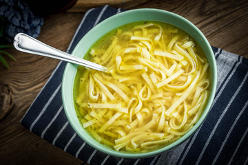 Broth - chicken soup in a bowl.