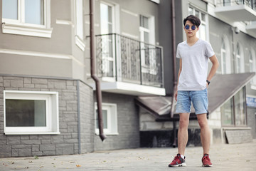 Asian young man wearing sunglasses outdoors