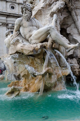 detail of the four rivers fountain in Navona Square.  Gange river metaphor. Rome, Italy