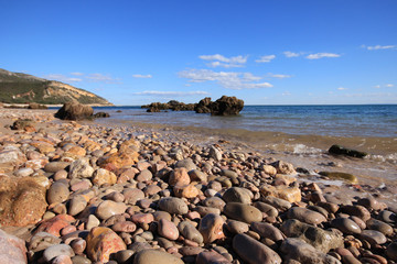 Fototapeta na wymiar Beach with turquoise sea water with amazing rocks. Setubal in Portugal