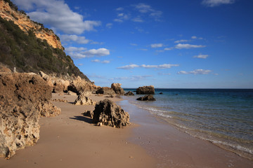 Fototapeta na wymiar Beach with turquoise sea water with amazing rocks. Setubal in Portugal