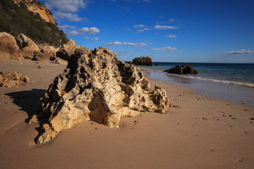 Beach with turquoise sea water with amazing rocks. Setubal in Portugal