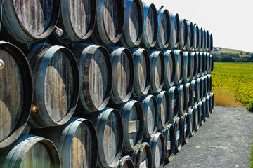 Decorative wine barrels stacked and lined up.