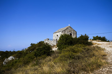 Fototapeta na wymiar Chapel on Hum peak - top of Vis island, Croatia. 