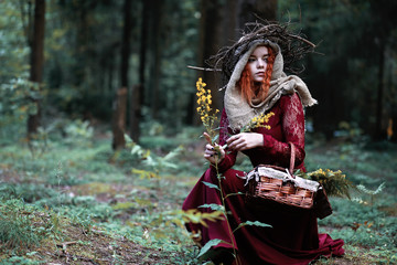 The red-haired witch holds a ritual with a crystal ball