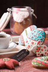   Beautiful glazed Easter cookies on wooden table