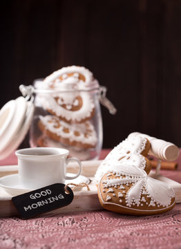 beautiful decorated cookies with a cup of coffee
