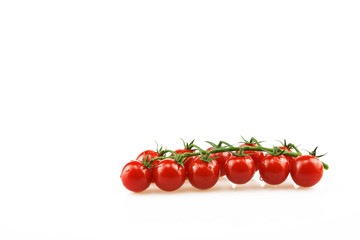 A group of fresh cherry tomatoes