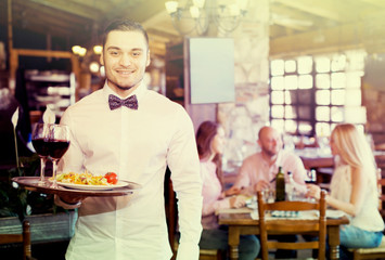 Portrait young male waiter