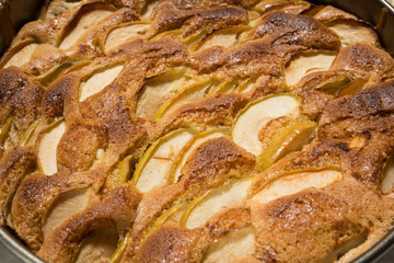 hot apple pie in a round shape, golden brown