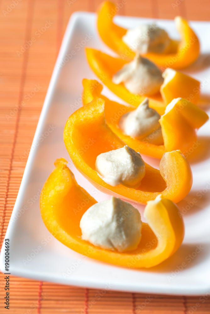 Poster Slices of bell pepper with hummus