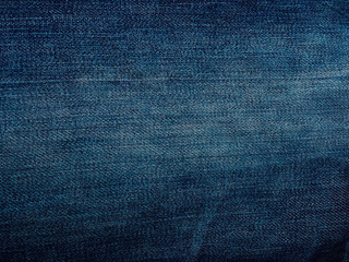 Jeans background. Jean texture. Blue jeans pattern no seam with macro style to preset about classic fashion cloths concept. Indigo color fabric.