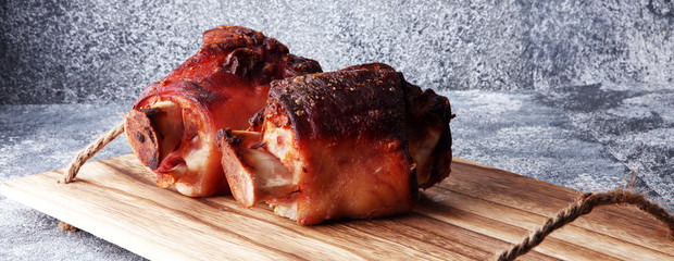 Roasted pork knuckle. Ham and bacon are popular foods in the west. German Schweinshaxe or Haxe