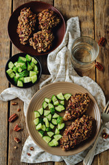 Pecan crust chicken breasts with cucumber's slices