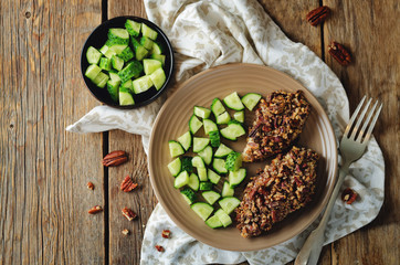 Pecan crust chicken breasts with cucumber's slices