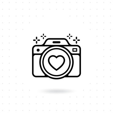 Camera icon. Vector for web and mobile applications. Photo camera outline vector icon. Camera icon with a heart symbol on the lens. Photography Vector illustration