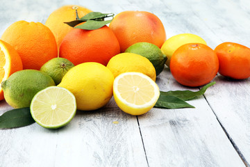 Citrus background. Assorted fresh citrus fruit. Lemon, orange lime, grapefruit. Fresh and colorful concept.