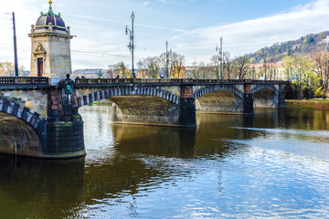 Fototapeta premium Beautiful view Old Bridge Legii, Most Legii, from the waterfront of the Vltava River.Prague.Czech Republic.