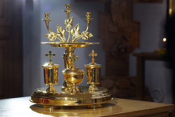 Fototapeta na wymiar Golden religious utensils. Details in the Orthodox Christian Church. Russia.