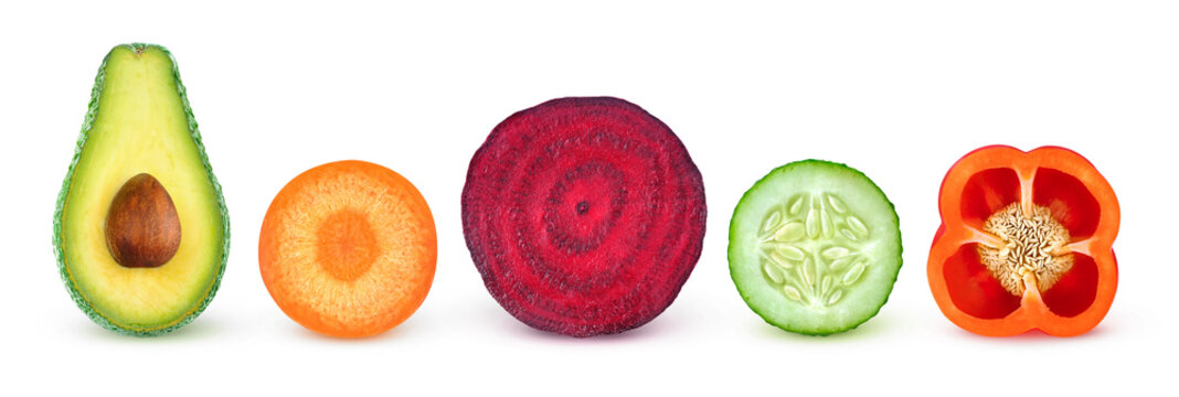 Fototapeta Isolated vegetable slices. Fresh vegetables cut in half (avocado, carrot, beetroot, cucumber, bell pepper) in a row isolated on white background with clipping path