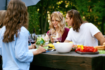 Happy Friends In Outdoor Picnic Party Having Fun