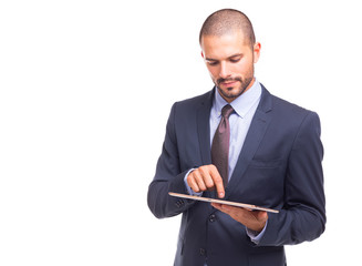 Confident young handsome businessman working on digital tablet, isolated on a white background