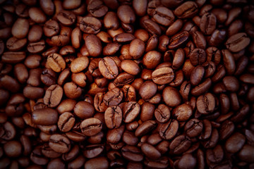 Obraz premium Close-up of roasted coffee beans background