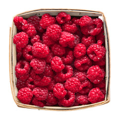 Fresh red raspberries in a market pint container isolated on white
