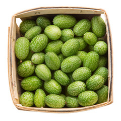 Sour Gherkin, Cucamelon, mini cucumbers in a market pint container isolated on white