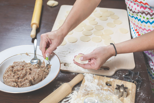 Woman makes dumplings at home