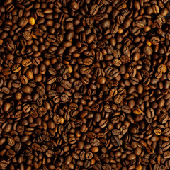 Coffee beans on a black textured background.