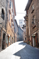 Medieval street in the Italian hill town of Assisi. The traditional italian medieval historic center in Umbria. Italy