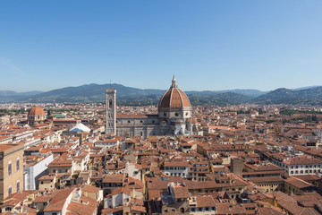 Fototapeta na wymiar Florentine cityscape with the Florence Cathedral in a sunny day, Tuscany, Italy.
