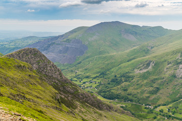 Walking down from Mount Snowdon on the Llanberis Path, Snowdonia, Gwynedd, Wales, UK - looking north towards the derelict Dinorwic Quarry