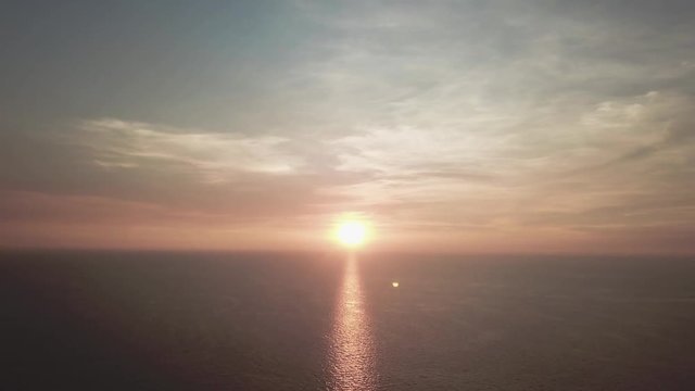 Panorama of beautiful sunset on the ocean. Video. View of sunset seascape in the middle of the ocean. Aerial