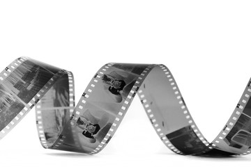 spiral of black and white negative film on white background