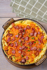Cheddar Mashed Potato Casserole with Bacon. Baked Cheddar Potato Casserole. View from above, top, vertical