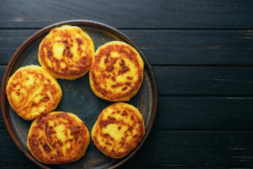 Hot homemade cottage cheese pancakes in plate top view