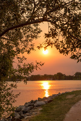 Fototapeta na wymiar Sunset reflecting on a lake
